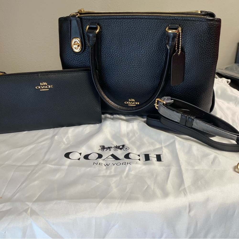 Coach handbag with wallet original used in good condition color black.